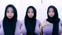 Ukhti Fira Bergaya Seksi Dengan Hijab Dan Baju Ungu Yang Menggoda